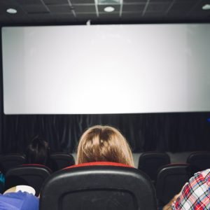 back-view-people-looking-cinema-screen_23-2147803852